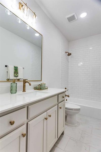 Full bath with vanity, shower / bathtub combination, light marble finish floors, and recessed lighting