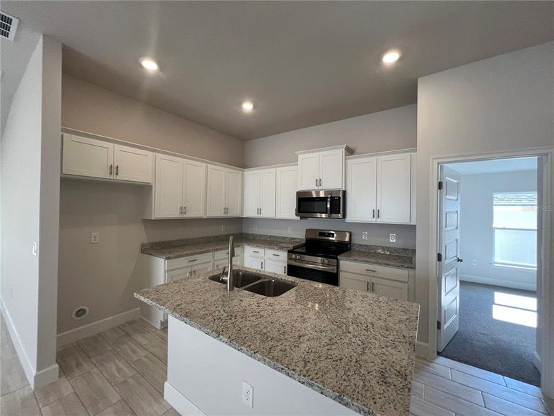 Furnished interior view inside a new home in Abbey Glen, Dade City (Image 7).