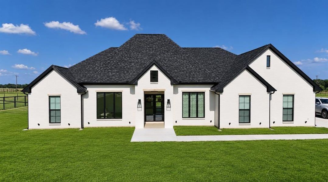 Front exterior of a new home in , Whitesboro, TX, highlighting curb appeal (Image 22).