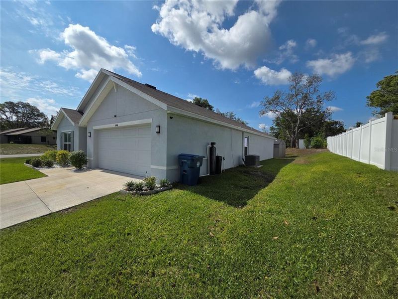 Front exterior of a new home in Hernando County Spot Lots, Spring Hill, FL, highlighting curb appeal (Image 24).