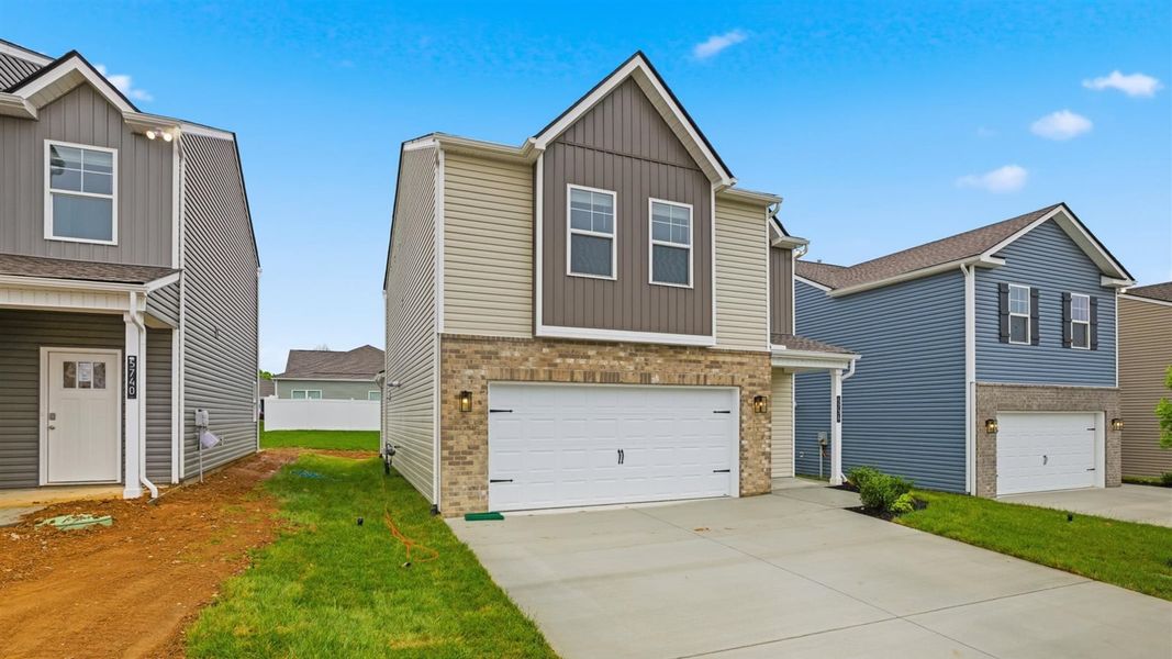 Front exterior of a new home in Price's Point, Knoxville, TN, highlighting curb appeal (Image 21). Front exterior of a new home in Price's Point, Knoxville, TN, highlighting curb appeal (Image 21).