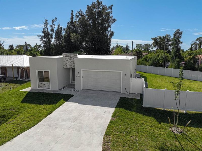 Front exterior of a new home in , North Port, FL, highlighting curb appeal (Image 2).