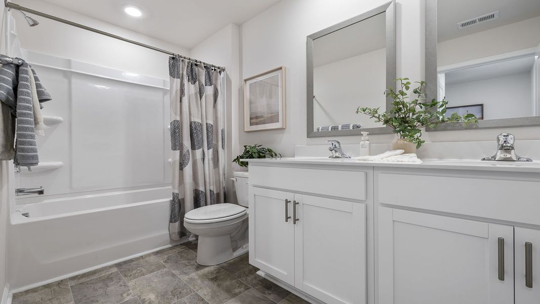 Furnished interior view inside a new home in Bentley Park, Greenwood (Image 20).