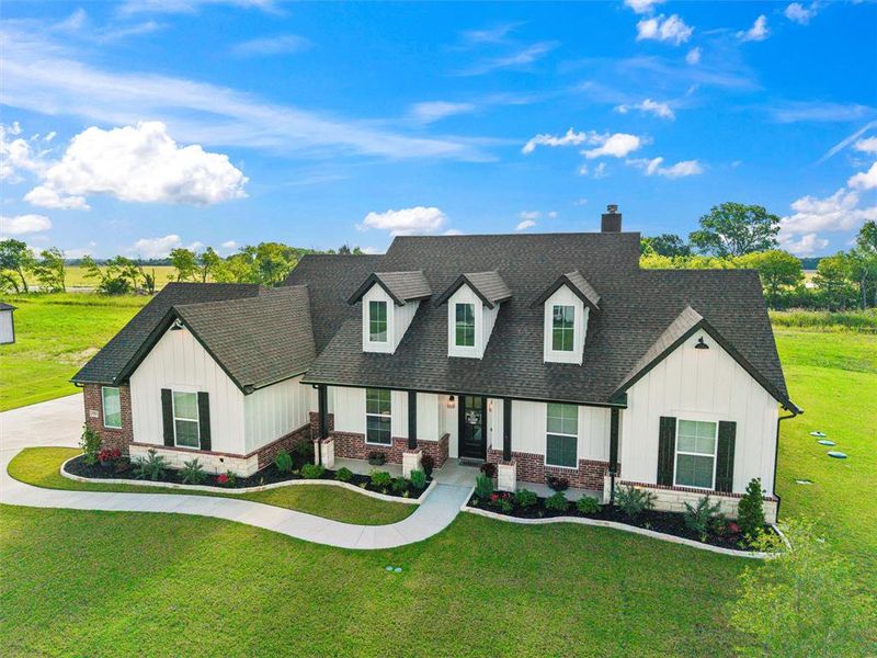 Front exterior of a new home in , Waxahachie, TX, highlighting curb appeal (Image 2). Front exterior of a new home in , Waxahachie, TX, highlighting curb appeal (Image 2).