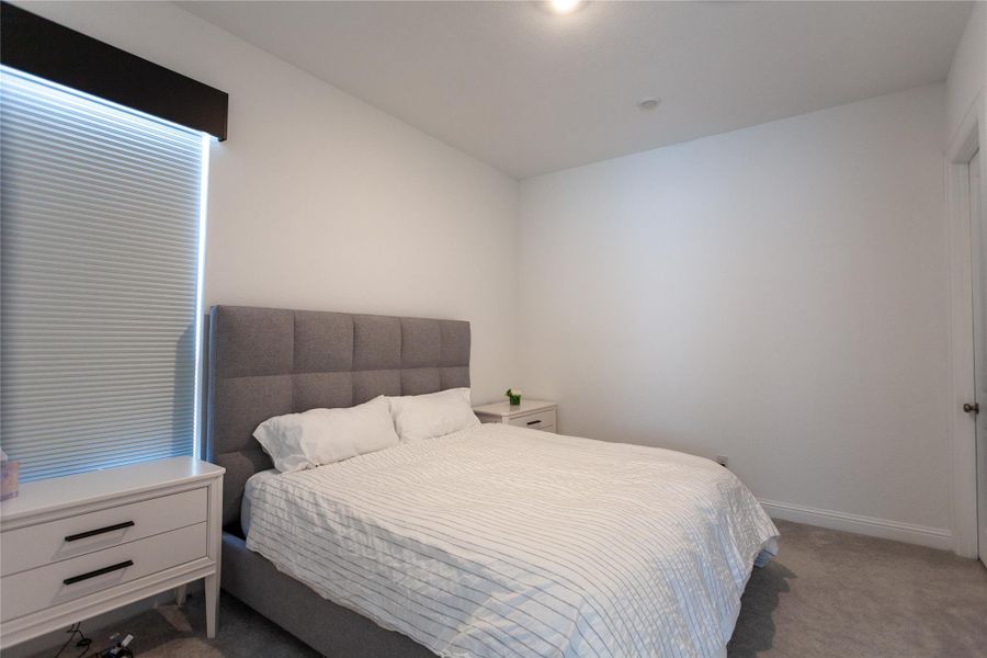 Light walls and carpet create a bright, inviting atmosphere.