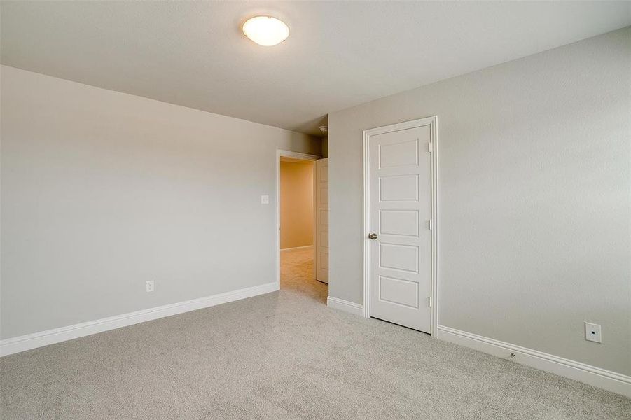 Spare room with carpet floors and baseboards