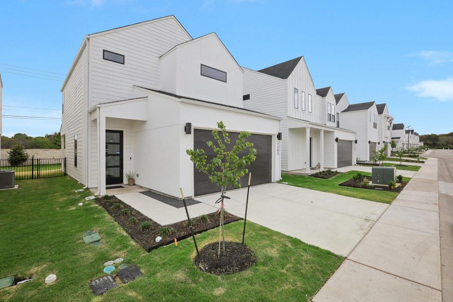 Front exterior of a new home in Novel, Austin, TX, highlighting curb appeal (Image 26).