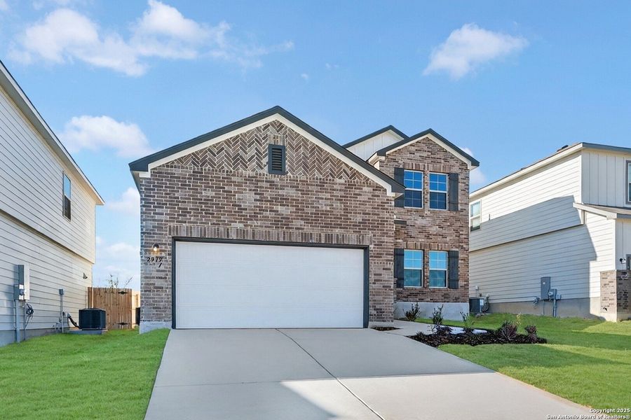 Front exterior of a new home in Paloma Park, Converse, TX, highlighting curb appeal (Image 2). Front exterior of a new home in Paloma Park, Converse, TX, highlighting curb appeal (Image 2).