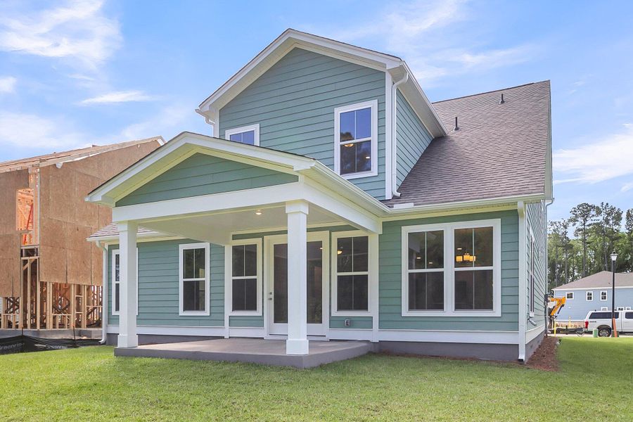 Front exterior of a new home in Tidewater at Lakes of Cane Bay, Summerville, SC, highlighting curb appeal (Image 2). Front exterior of a new home in Tidewater at Lakes of Cane Bay, Summerville, SC, highlighting curb appeal (Image 2).
