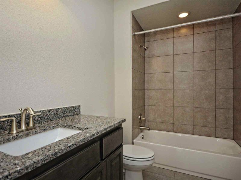 Representative furnished interior of a home built from the Madera II by Giddens Homes in Scofield Farms Estates, Georgetown (Image 272).