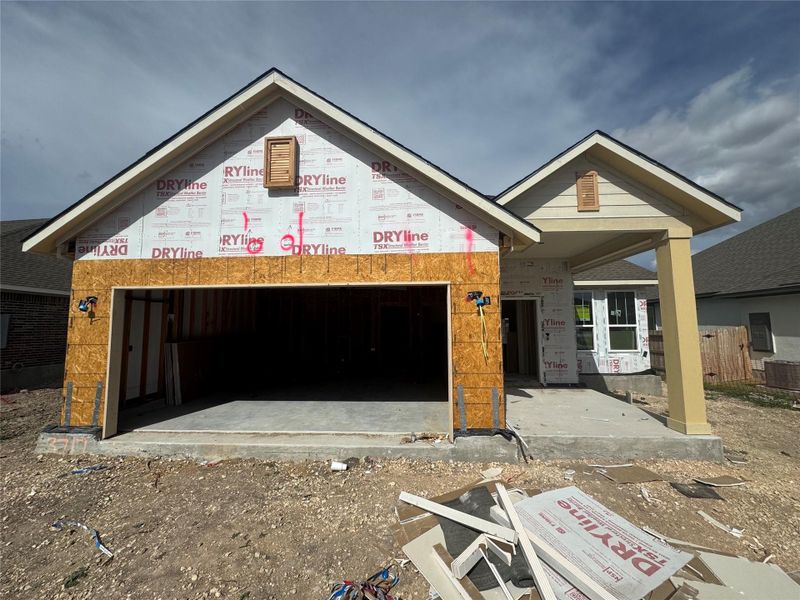 Front exterior of a new home in Village at Three Oaks, Seguin, TX, highlighting curb appeal (Image 11).