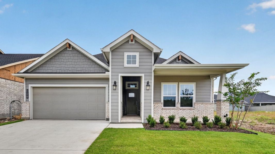 Representative exterior photo of a completed home built from the Desert Willow by D.R. Horton in Treeline, Justin, TX (Image 1). Representative exterior photo of a completed home built from the Desert Willow by D.R. Horton in Treeline, Justin, TX (Image 1).
