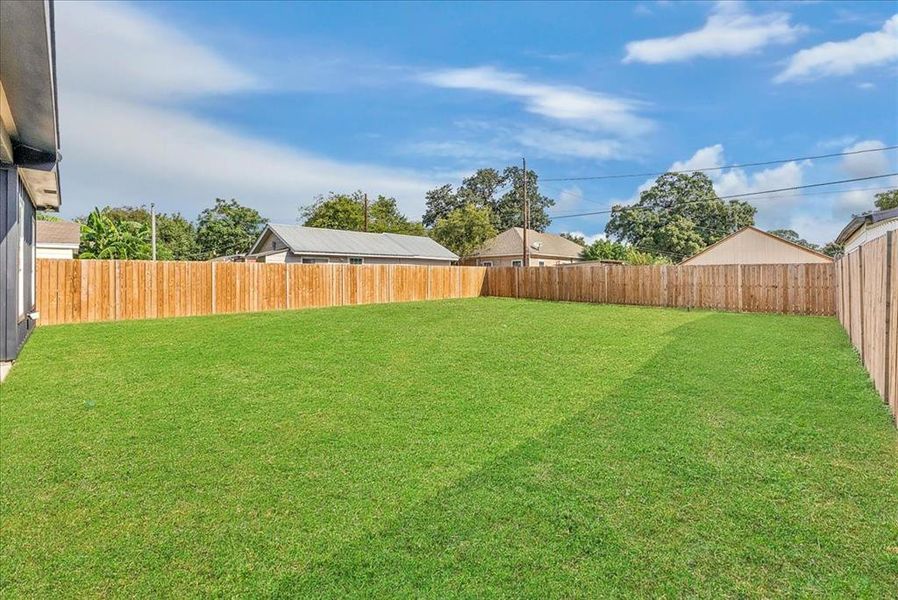 View of fenced backyard