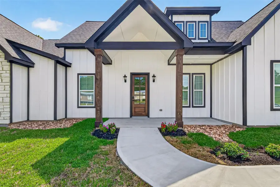 Enjoy the outdoors from the welcoming front porch or the covered rear patio,