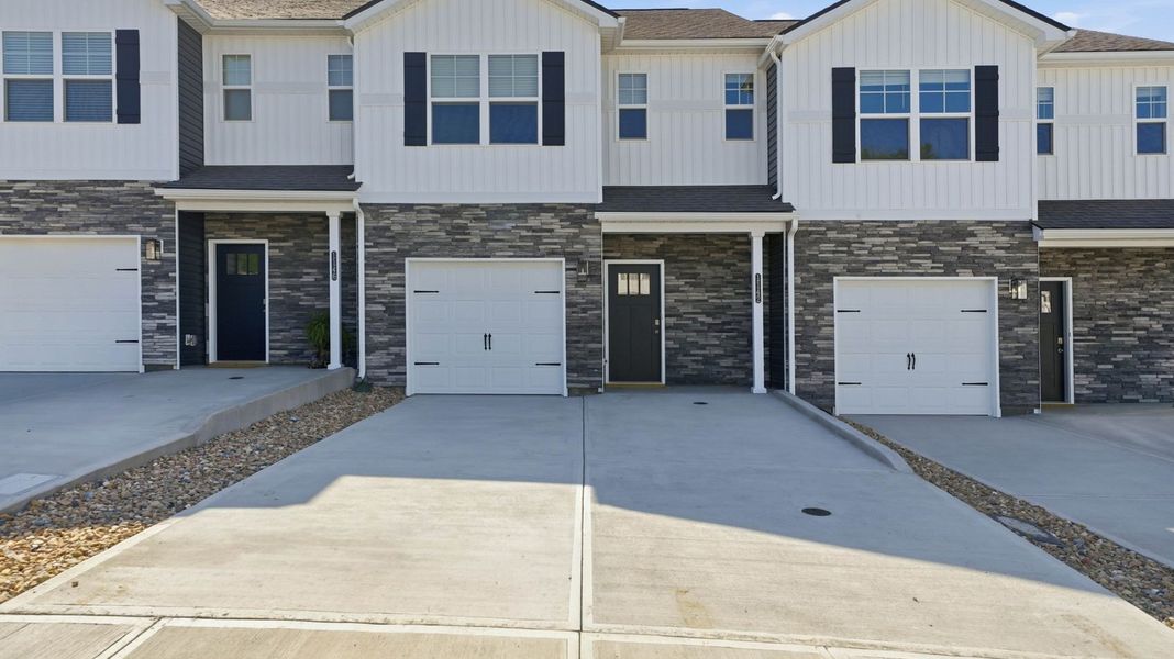 Front exterior of a new home in The Arbor Townhomes, Kingsport, TN, highlighting curb appeal (Image 2). Front exterior of a new home in The Arbor Townhomes, Kingsport, TN, highlighting curb appeal (Image 2).