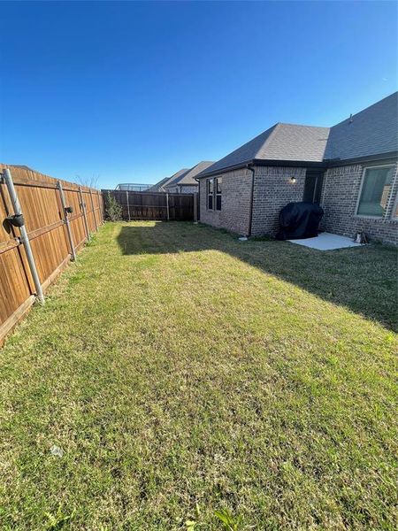 Exterior details and patio area of a home in Stonehaven, Seagoville (Image 18).