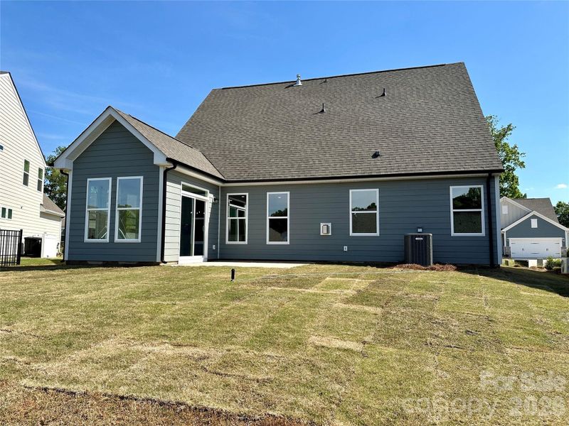 Exterior details and patio area of a home in Villas at Prestwick, Mooresville (Image 2).