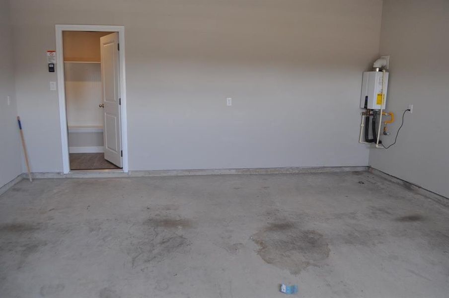 Garage featuring water heater