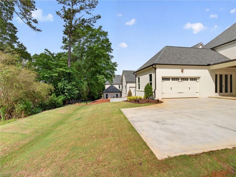 Front exterior of a new home in , Suwanee, GA, highlighting curb appeal (Image 28).