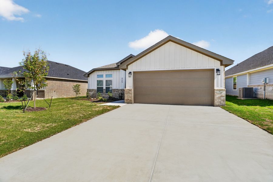 Front exterior of a new home in Craftsman's Corner, Cleburne, TX, highlighting curb appeal (Image 19).