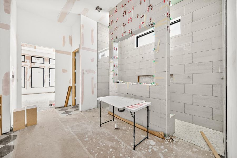 Primary bath with water closet and standing shower. 6' free standing tub will be installed in front of the shower.