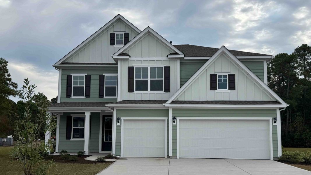 Front exterior of a new home in The Preserve at Shaftesbury Glen, Conway, SC, highlighting curb appeal (Image 1). Front exterior of a new home in The Preserve at Shaftesbury Glen, Conway, SC, highlighting curb appeal (Image 1).