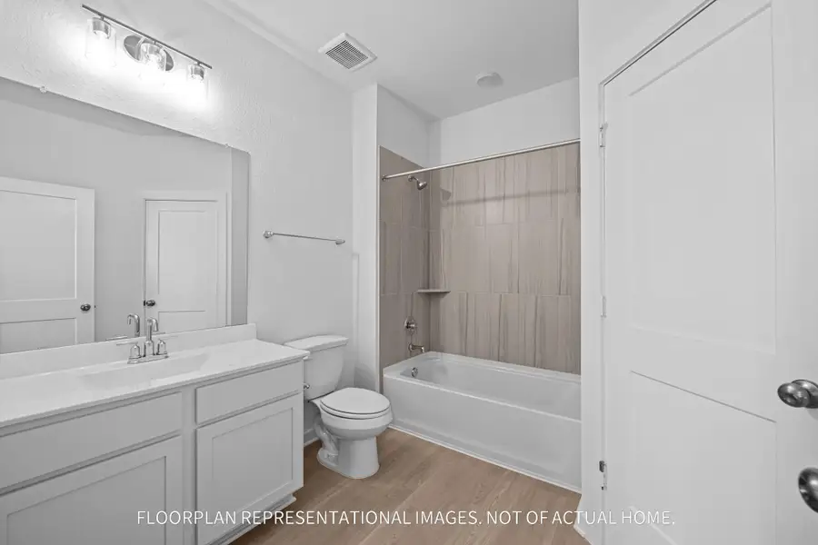 Furnished interior view inside a new home in The Oaks on 6th Street, Magnolia (Image 5).