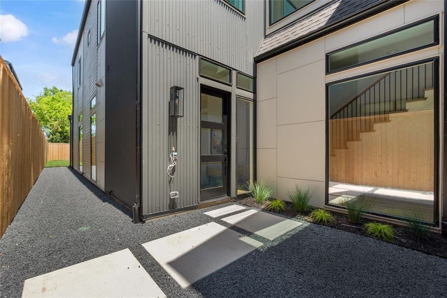 Property entrance with a patio area