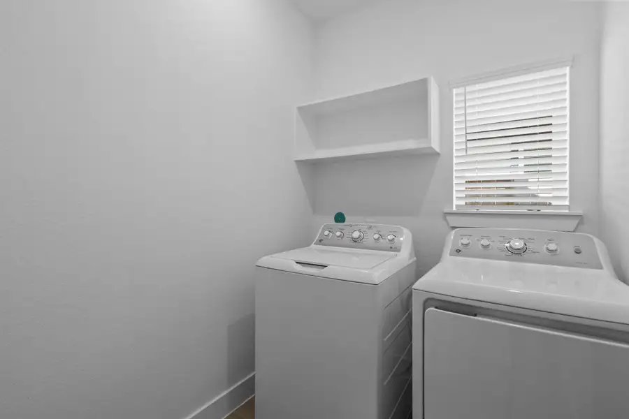 Furnished interior view inside a new home in Meridiana, Iowa Colony (Image 10).