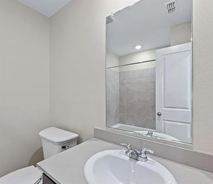 Bathroom featuring toilet and vanity