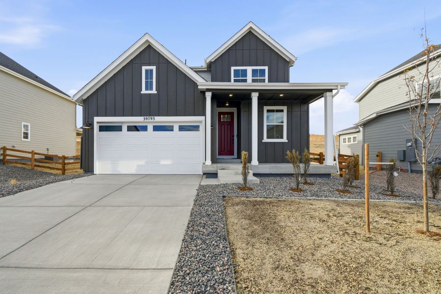 Front exterior of a new home in The Town Collection at Independence, Elizabeth, CO, highlighting curb appeal (Image 1). Front exterior of a new home in The Town Collection at Independence, Elizabeth, CO, highlighting curb appeal (Image 1).