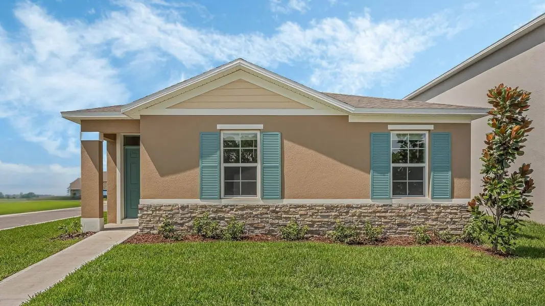 Front exterior of a new home in Crossroads at Kelly Park, Apopka, FL, highlighting curb appeal (Image 1). Front exterior of a new home in Crossroads at Kelly Park, Apopka, FL, highlighting curb appeal (Image 1).