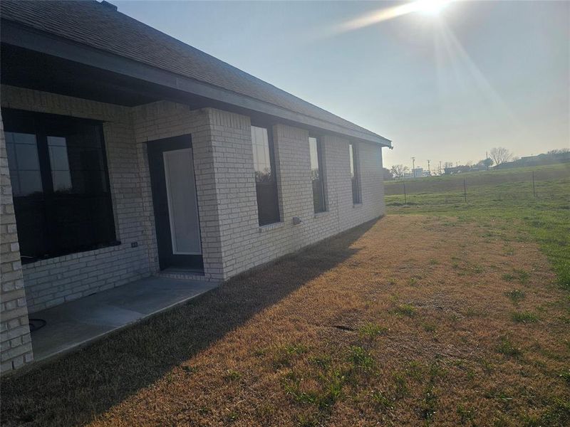 View of home's exterior with a lawn