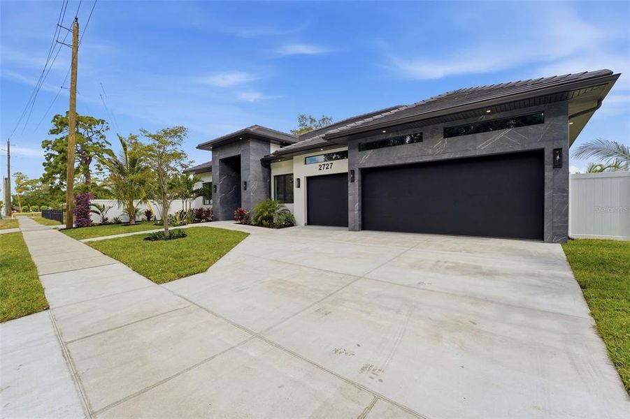 Front exterior of a new home in , Sarasota, FL, highlighting curb appeal (Image 27).
