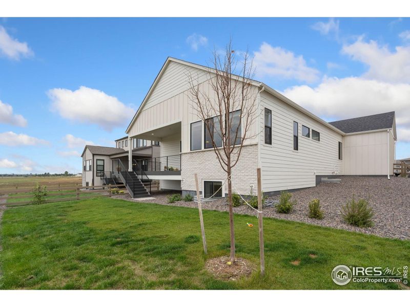 Front exterior of a new home in , Timnath, CO, highlighting curb appeal (Image 25).