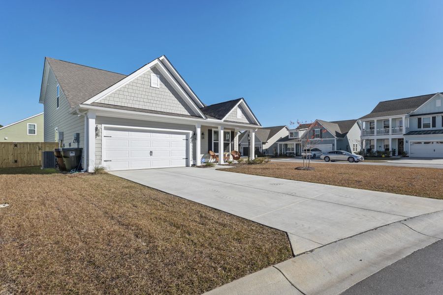 Front exterior of a new home in High Point at Foxbank, Moncks Corner, SC, highlighting curb appeal (Image 22).