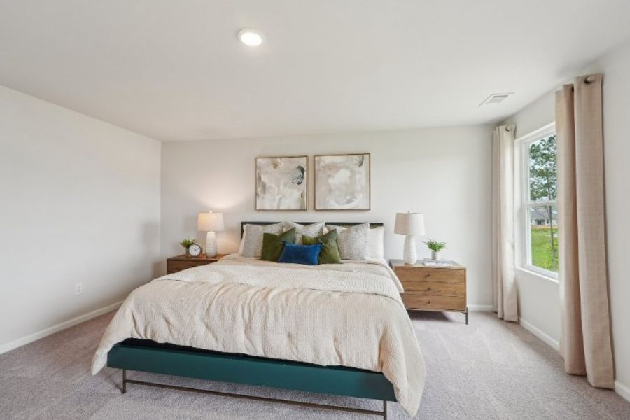 A bedroom with a bed and lamps. A bedroom with a bed and lamps.