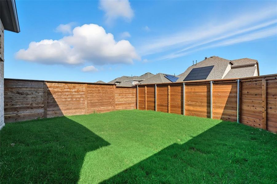 View of fenced backyard