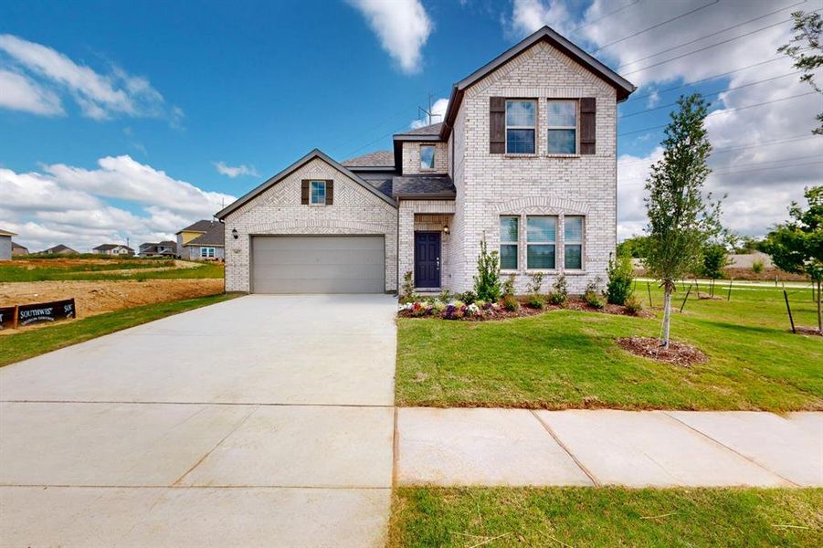 Front exterior of a new home in Kings Way, Denton, TX, highlighting curb appeal (Image 2). Front exterior of a new home in Kings Way, Denton, TX, highlighting curb appeal (Image 2).