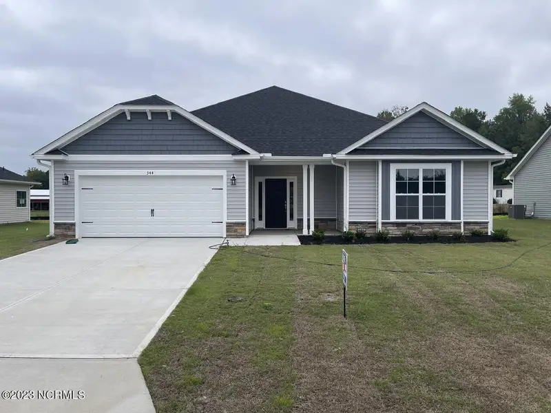 Front exterior of a new home in Summer Place, Grimesland, NC, highlighting curb appeal (Image 1).