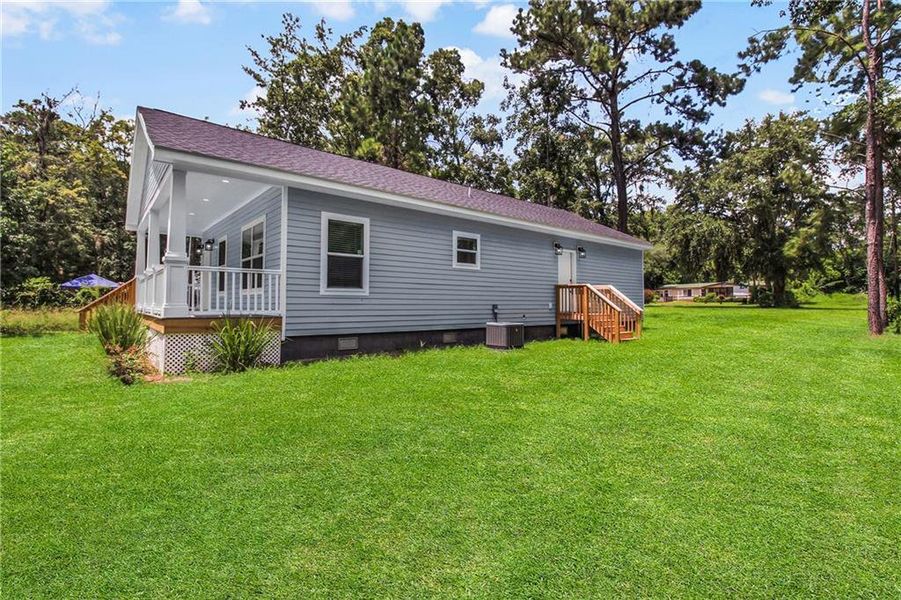 Front exterior of a new home in , Ludowici, GA, highlighting curb appeal (Image 2).