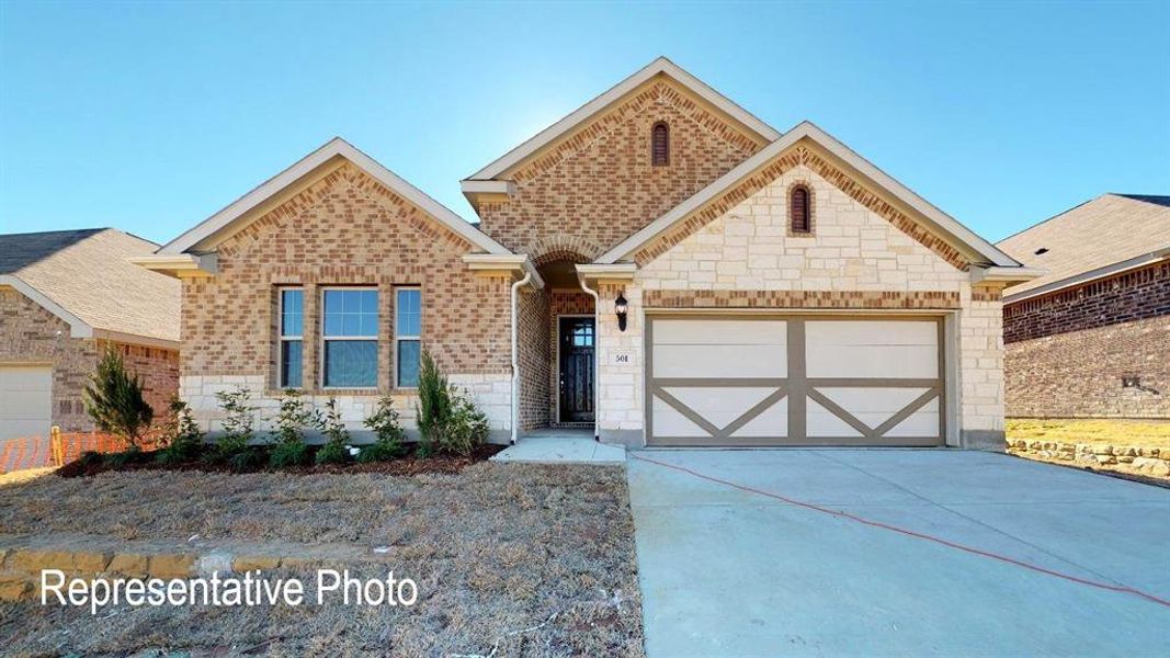 View of front of property with a garage