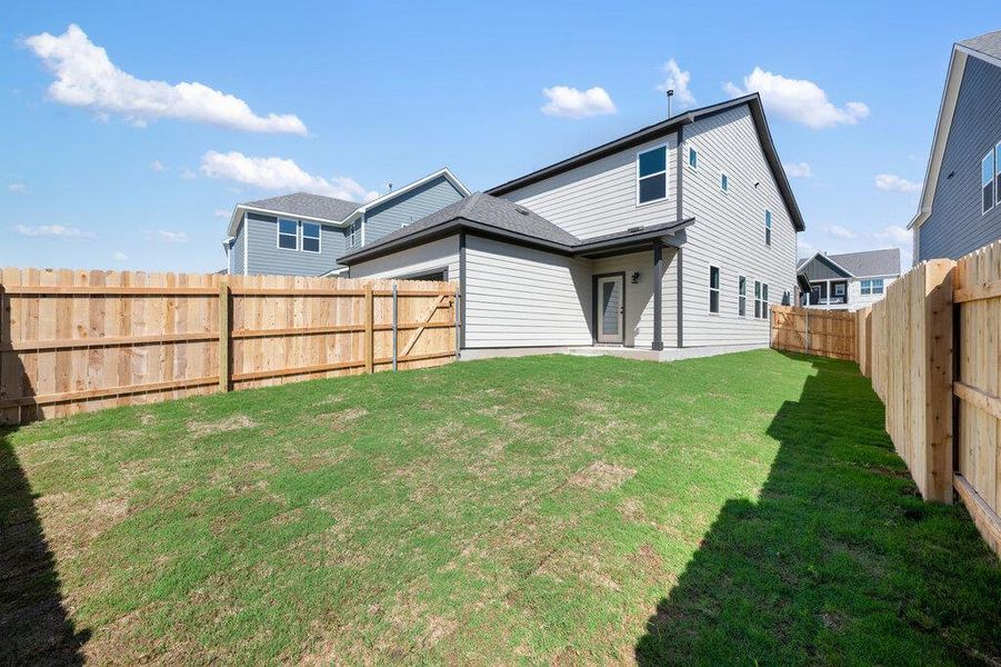 Exterior details and patio area of a home in Lariat, Liberty Hill (Image 27).