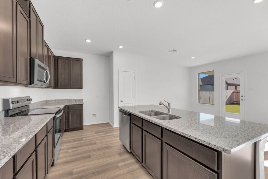 Furnished interior view inside a new home in Mustang Valley, Manor (Image 5).