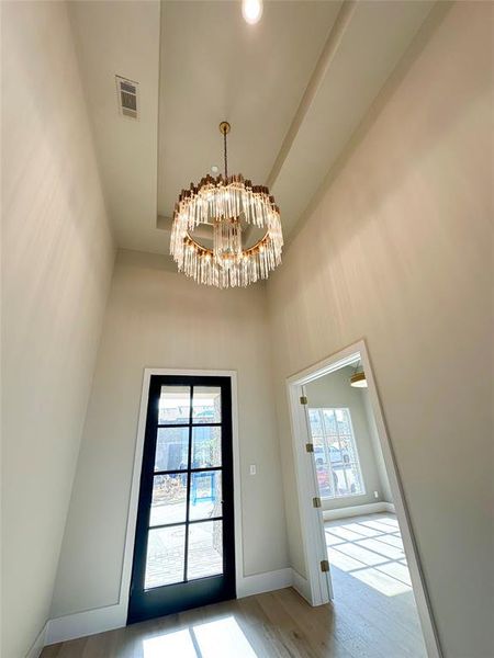 Elegant chandelier at spacious entry.