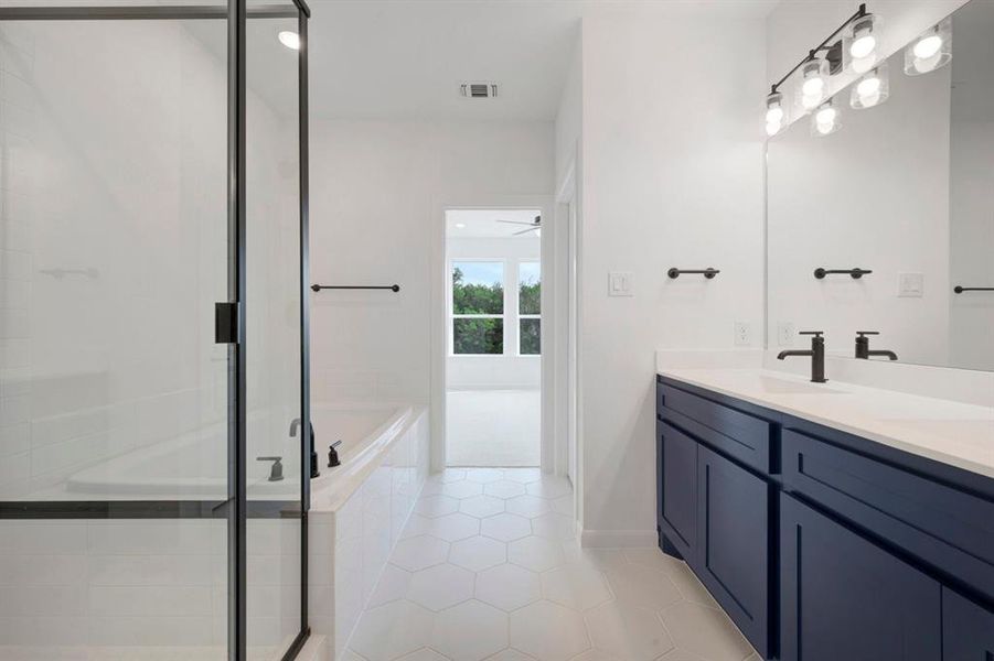 Spacious bathroom with hexagonal tile flooring