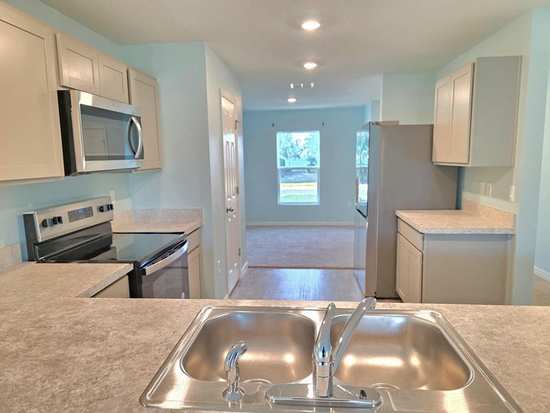 View of Kitchen Area that leads into Formal Dining Rm