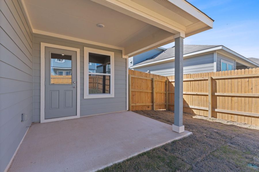 View of patio with fence