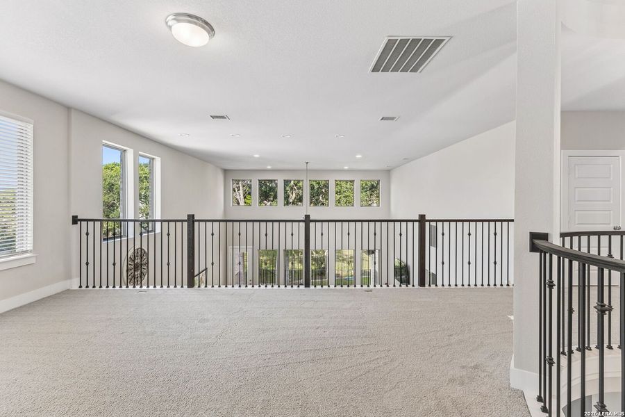 Spacious, unfurnished interior of a new home in 6 Creeks, Kyle (Image 16).