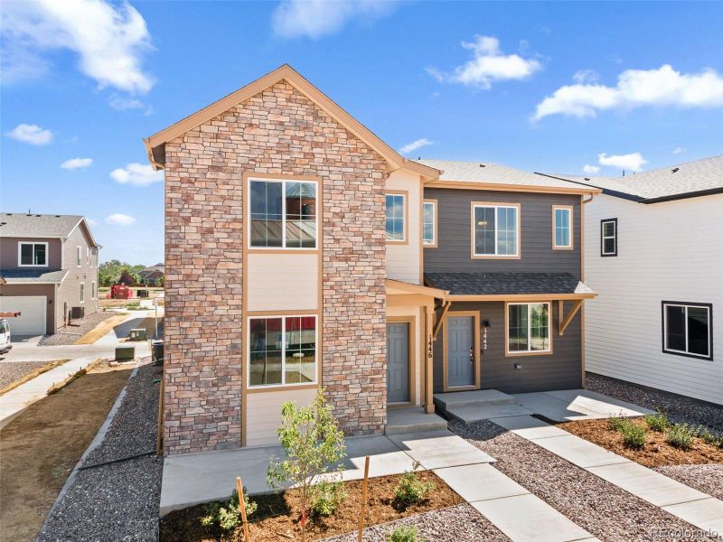 Front exterior of a new home in Spring Valley, Longmont, CO, highlighting curb appeal (Image 2).